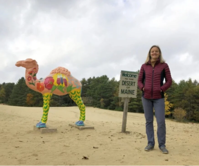 Desert of Maine co-owner with camel